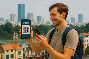 Traveler in Vietnam activating eSIM by scanning QR code with skyline in background